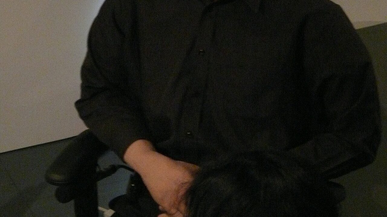 Roboticist Hiroshi Ishiguro seated beside Geminoid HI-1, the android built as his physical double, at Ars Electronica Festival 2009.